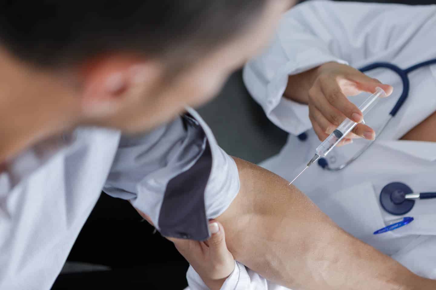 doctor injection flu vaccine to patients arm p49v6rl1 1